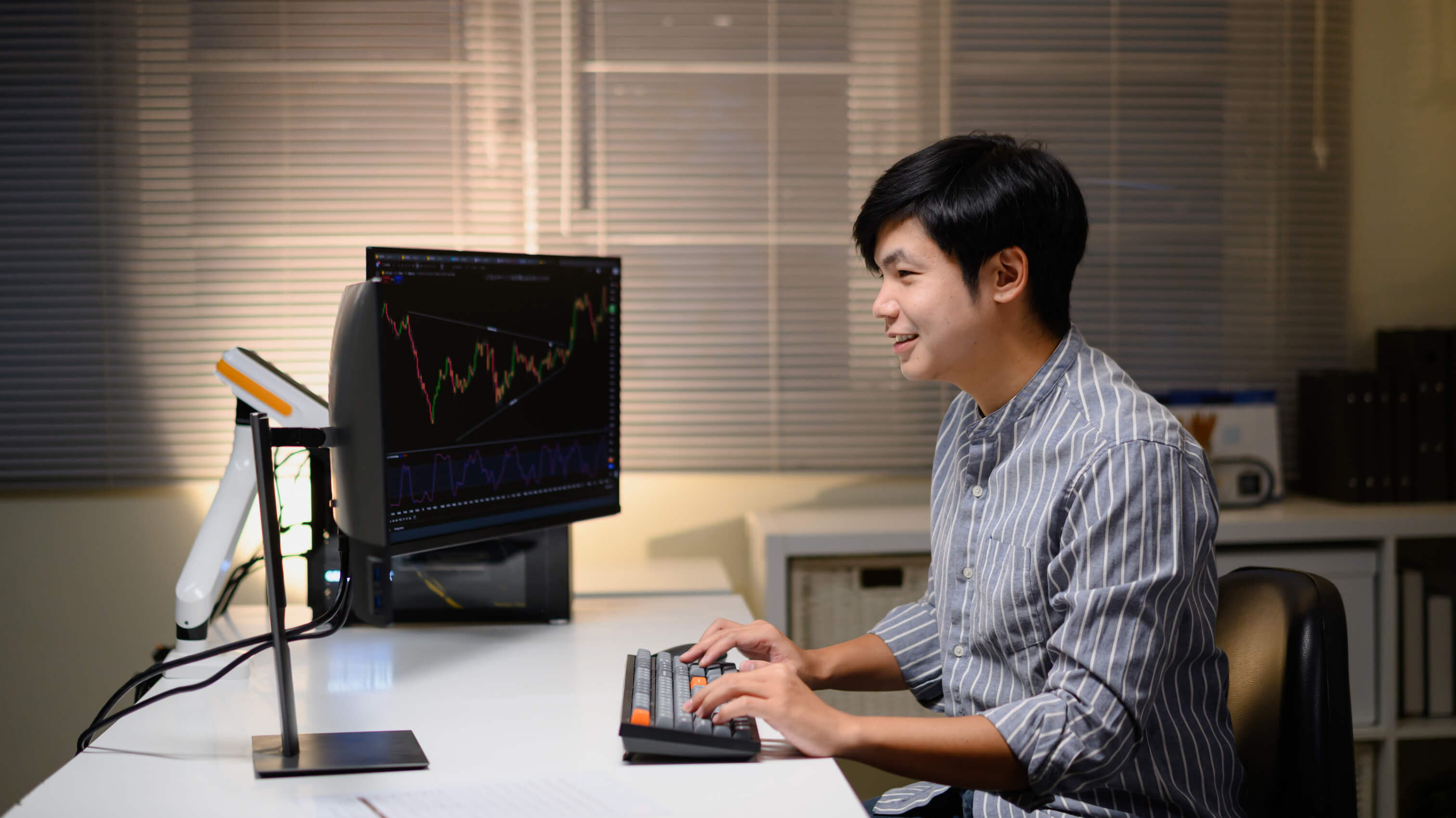 Young trader focused on charts